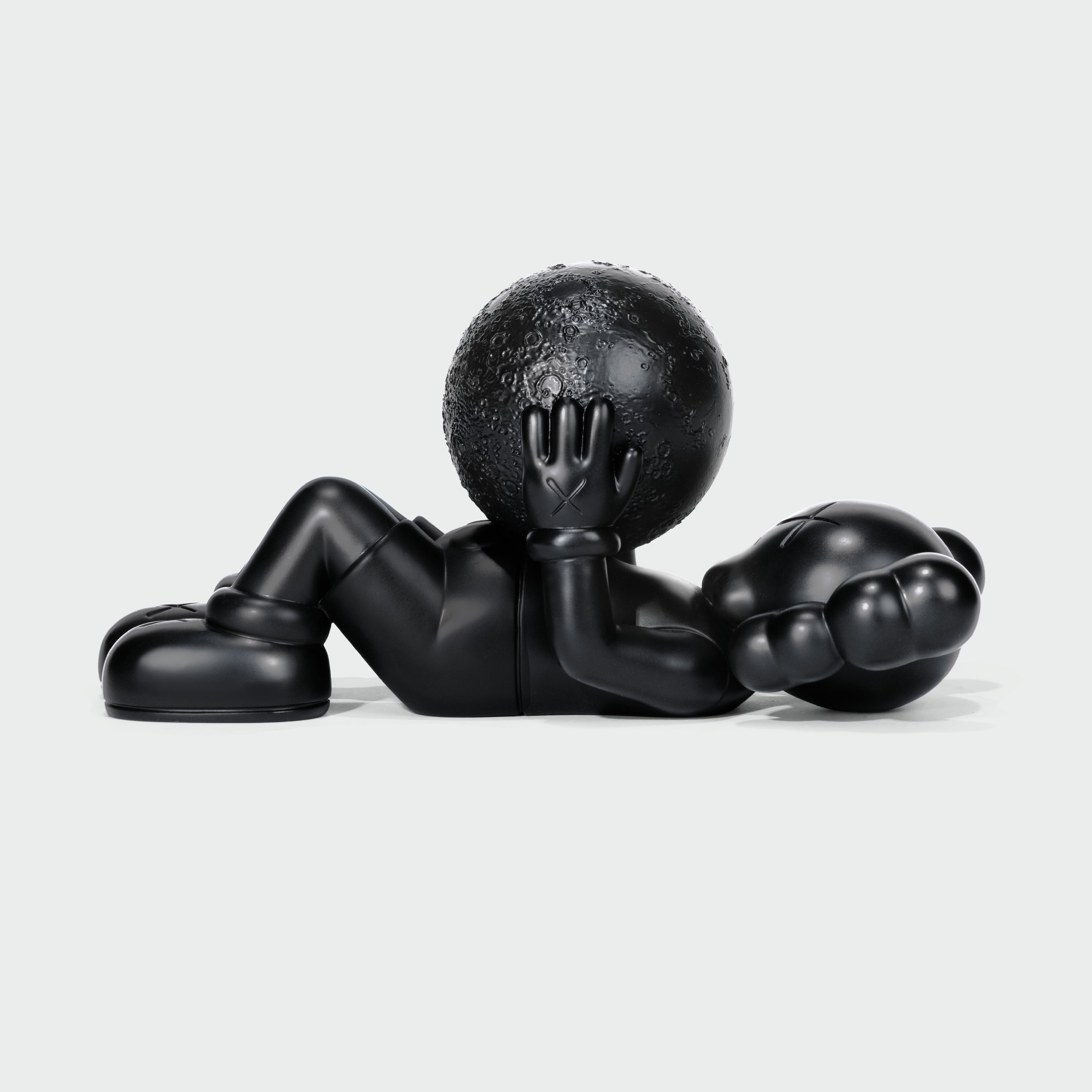 KAWS Calm Night Bronze Sculpture lying down. Side view showing solid bronze material. Includes wooden box and signed COA. Verified authentic by Art Trader.-2