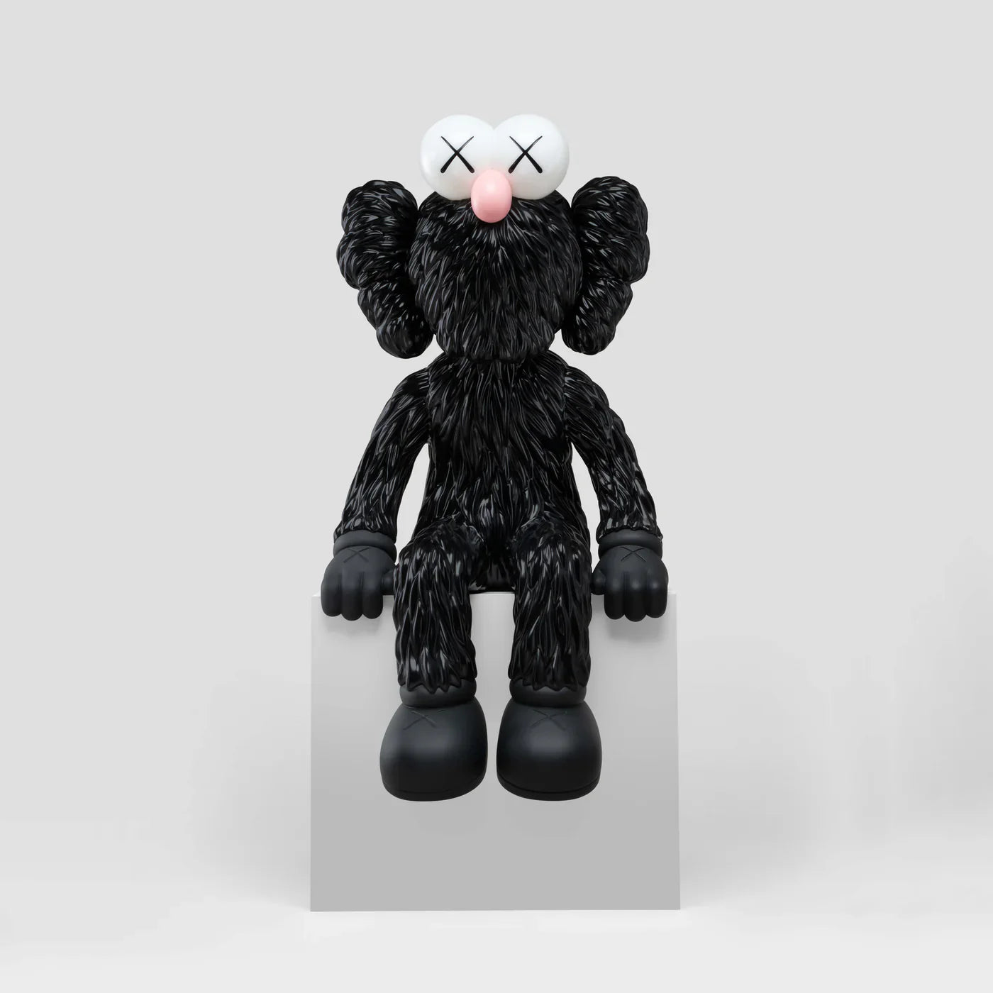 KAWS SEEING Black Alloy Sculpture with blue LED eyes lighting up. Verified condition by Art Trader. Side view of heavy metal art toy.