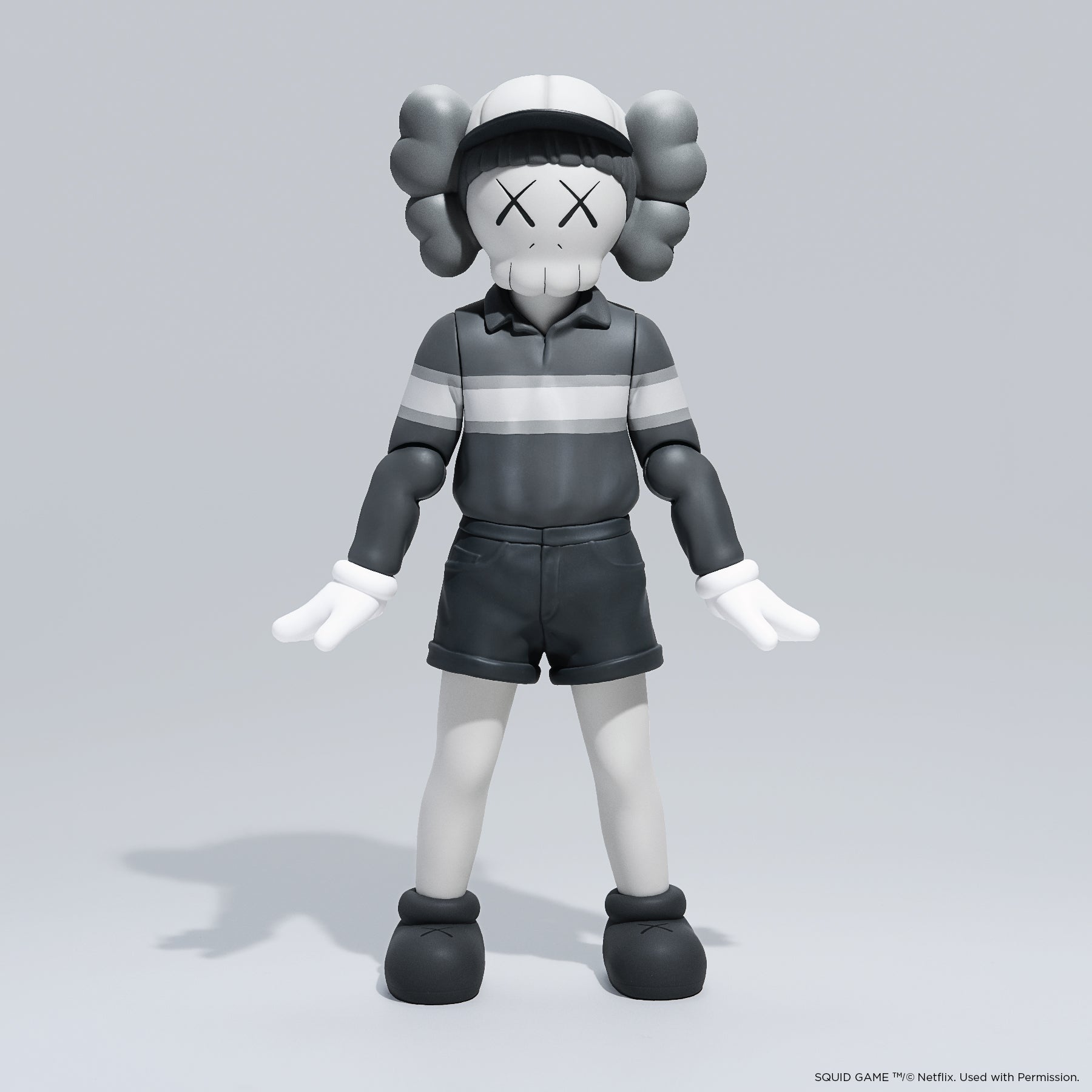 KAWS Chul-Su Monotone Grey Vinyl Figure 2025. Side profile showing NFC tag capability. Authentic art toy verified by Art Trader.
